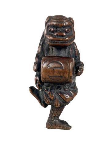 Netsuke of a Shishi Masked Child, Wood Japanese Edo 18th. Century