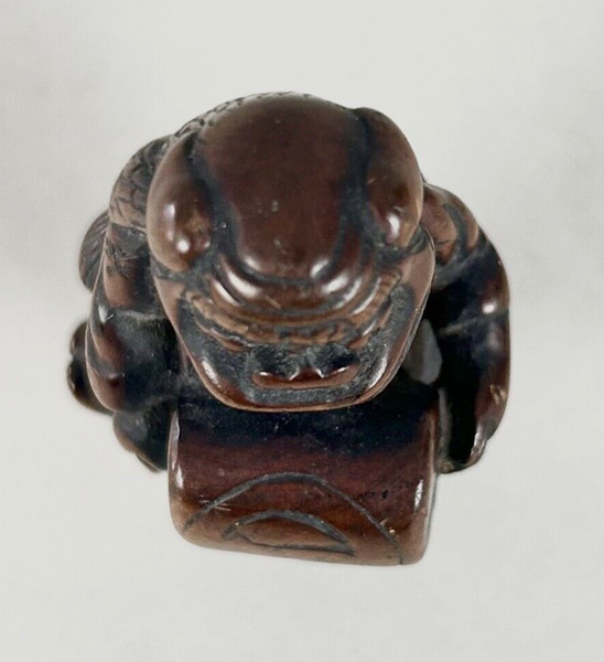 Netsuke of a Shishi Masked Child, Wood Japanese Edo 18th. Century
