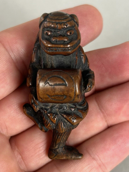 Netsuke of a Shishi Masked Child, Wood Japanese Edo 18th. Century